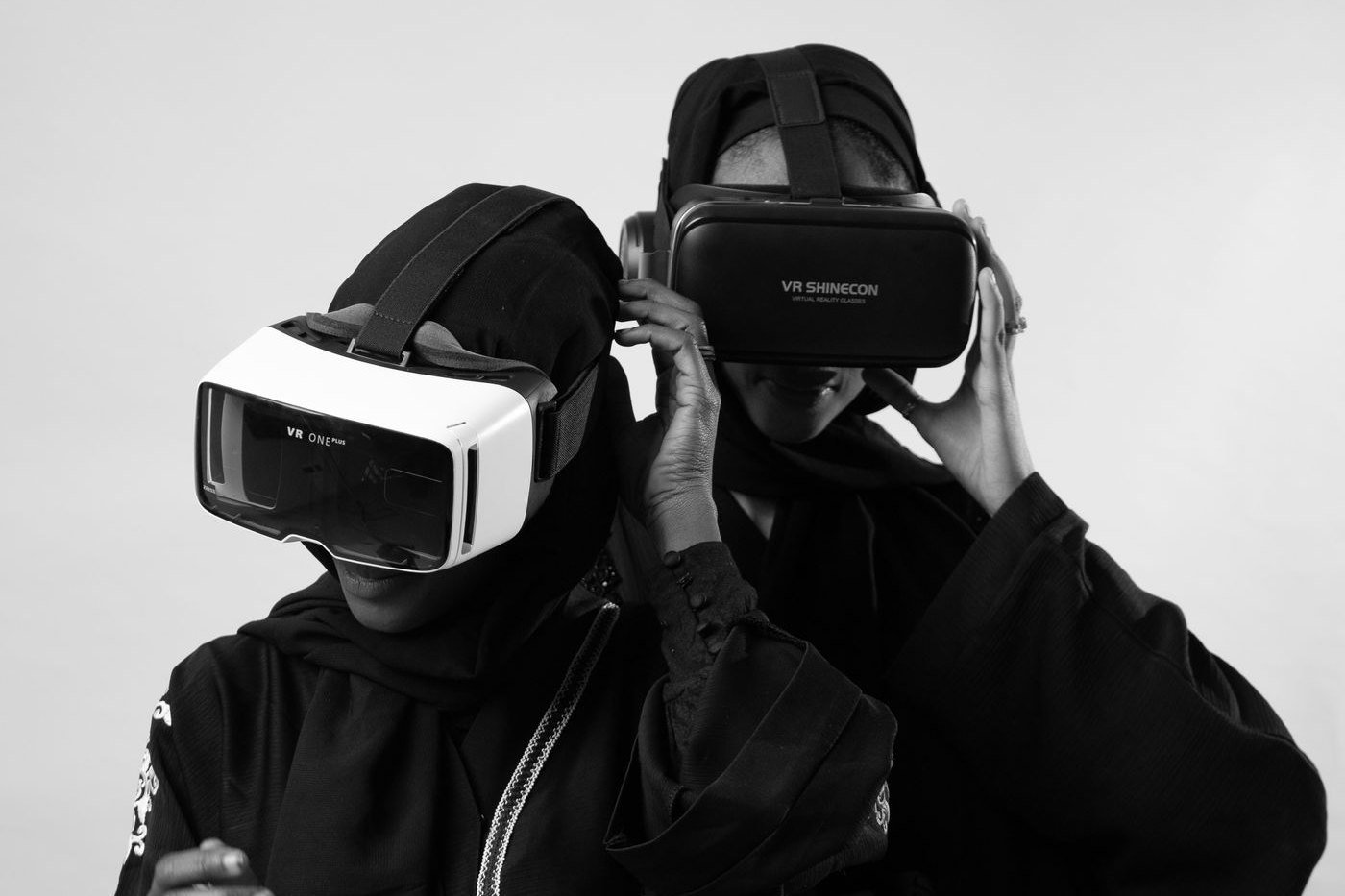 Two people wearing virtual reality headsets during a shared review session.